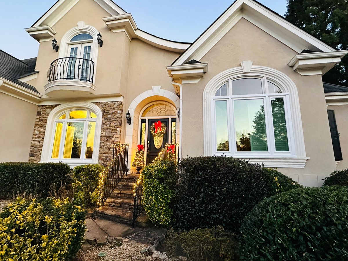 Stucco entry with new arched windows and balcony door — Vinings, GA